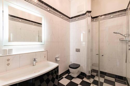 a bathroom with a sink and a shower at Apartment Wilhelmine in Borkum