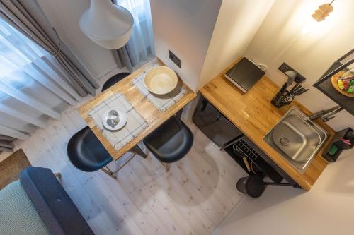 an overhead view of a room with a table and chairs at B2 Apartments in Klaipėda