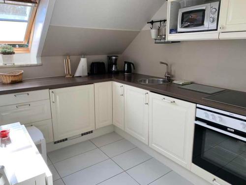 Kuchyň nebo kuchyňský kout v ubytování Ferienwohnung Möwennest