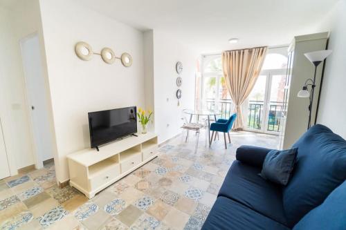 Televízia a/alebo spoločenská miestnosť v ubytovaní Apartamento Torresol #