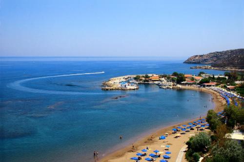 an aerial view of a beach with umbrellas and the ocean at Saint Amon Hotel in Faliraki