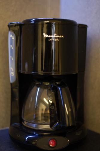a black coffee maker sitting on top of a counter at Spacious Fully Equipped 3BD 2Bath Apt in the heart of city with Balconies AC and fast WIFI #1 in Heraklio Town