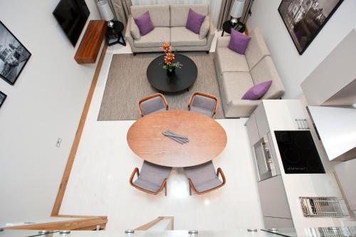 an overhead view of a table and chairs in a living room at Sanctum Belsize Road in London