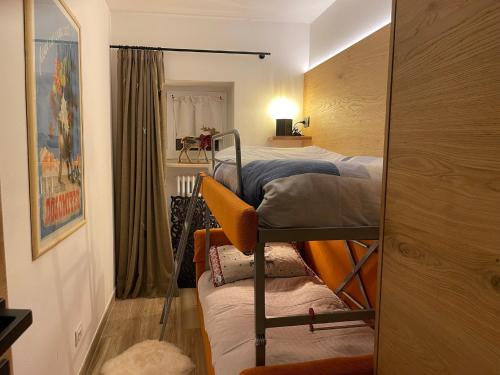 a bedroom with two bunk beds and a mirror at Val Gardena in Selva di Val Gardena