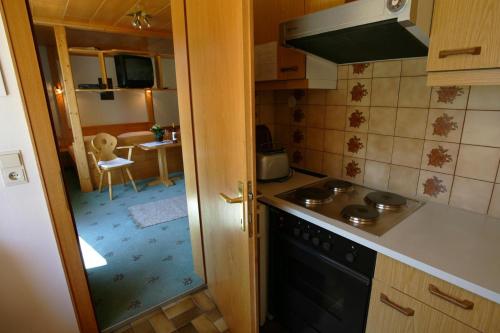 a kitchen with a sink and a stove top oven at Ferienwohnungen Stemer in Schruns-Tschagguns