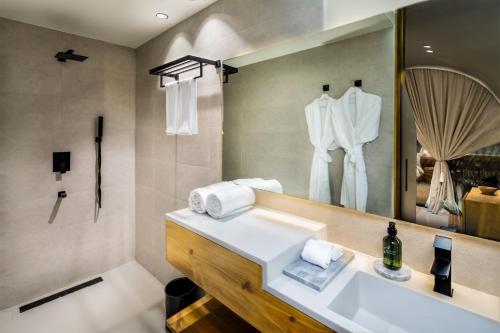 a bathroom with a sink and a mirror at Terra Solis Dubai in Dubai