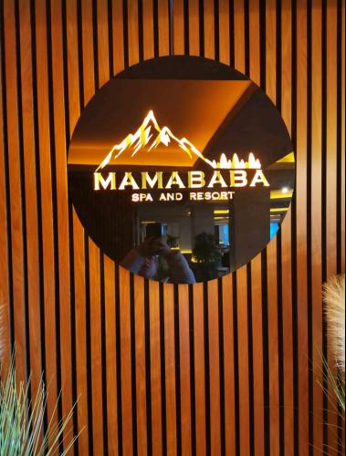 a mirror on a wall with a sign on it at Apartman D&V Milmari Resort S10 in Kopaonik