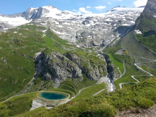 an aerial view of a mountain valley with a lake at Haus Traudl in Mayrhofen