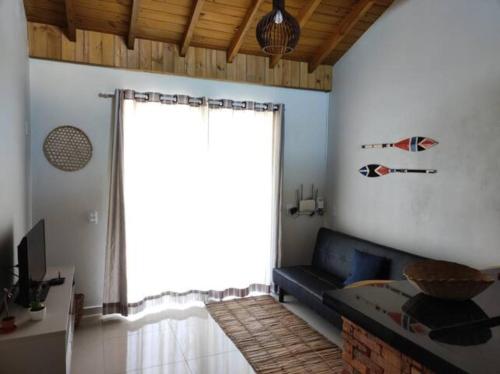 Cama o camas de una habitación en Casa Oryba pertinho do mar da Ribanceira em Imbituba