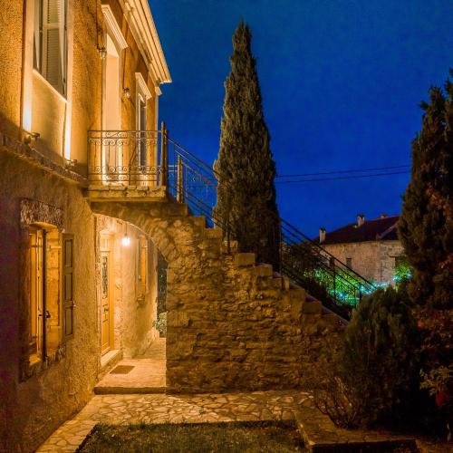 an alley in an old town at night at Archontiko Parnassus Dadi in Amfiklia