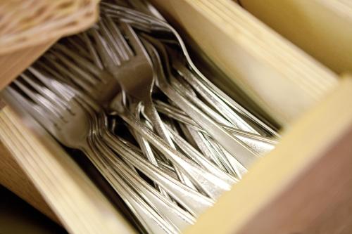 a bunch of forks sitting in a drawer at Gasthof Lerner in Freising