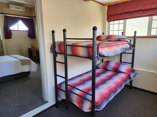 a couple of bunk beds in a room at Royal Hotel Ladysmith in Ladysmith