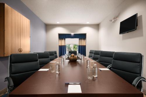 a conference room with a long table and chairs at Microtel Inn & Suites by Wyndham in Lynchburg