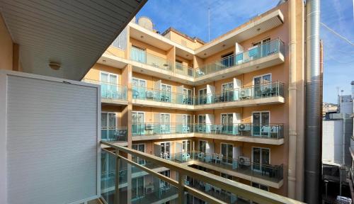 an external view of a building with balconies at Hotel Maria del Mar in Lloret de Mar