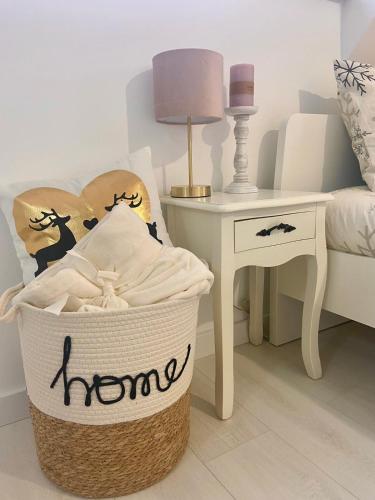 a laundry basket with a bed and a table at Farmhouse Dzeni in Vlasic