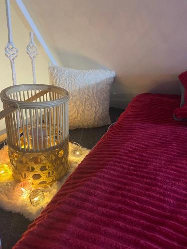 a bedroom with a bed and a basket on the floor at Farmhouse Dzeni in Vlasic