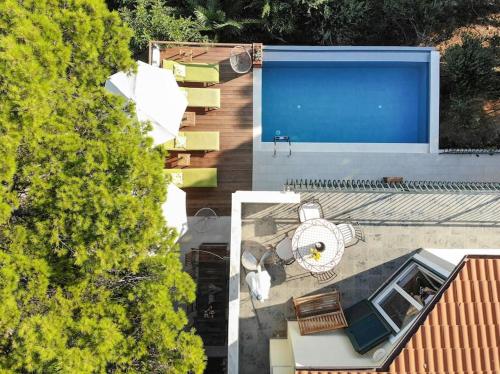 an overhead view of a house with a swimming pool at 4 bedrooms villa Hvar located 100m from the sea and 1,5 km from Hvar old town in Hvar