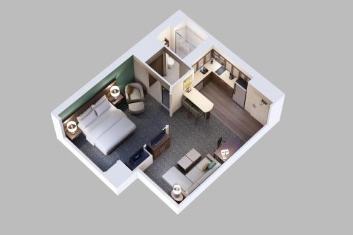 a rendering of a floor plan of a room at Staybridge Suites London by IHG in London