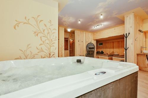a large white bath tub in a kitchen at Landhotel Berger in Ainring