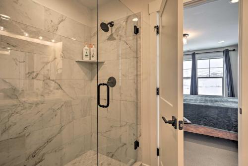 a bathroom with a shower with a glass door at Cozy Townhome about 7 Mi to Deer Valley Resort in Keetley Junction