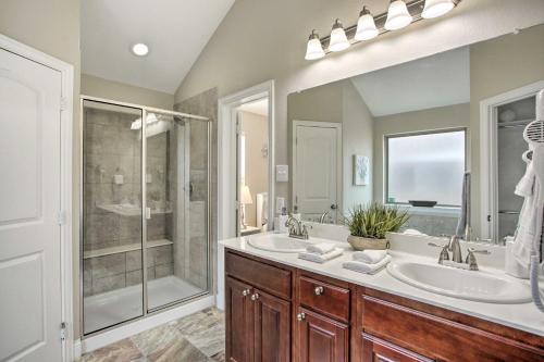 a bathroom with two sinks and a shower at Greenville Vacation Rental with Gas Grill! in Greenville