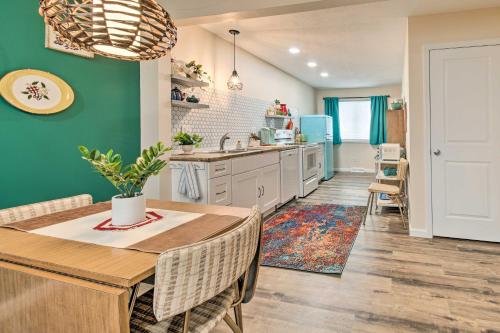 a kitchen and dining room with a table and chairs at Stylish Vacation Rental - Walk to ISU! in Normal