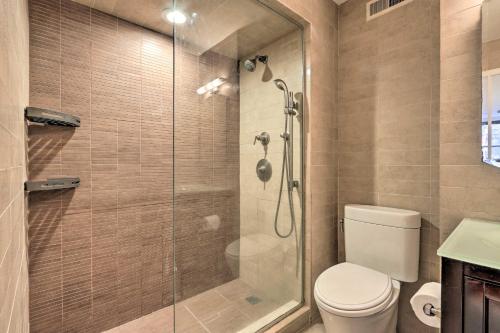 a bathroom with a toilet and a glass shower at Hoboken Condo 4 Mi to Times Square! in Hoboken