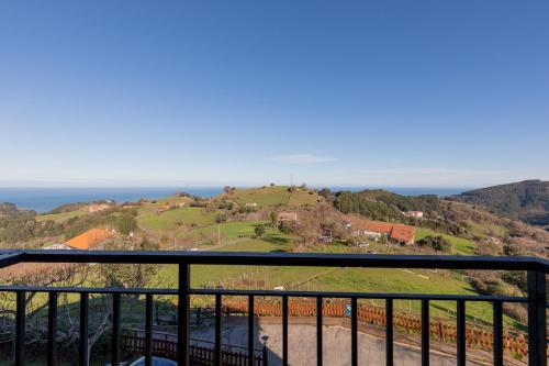 a view of the ocean from a balcony at Casa Rural Zelaieta BerriBi in Itziar