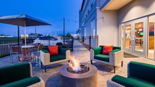 a patio with chairs and a fire pit at Holiday Inn - Clarksville Northeast by IHG in Clarksville