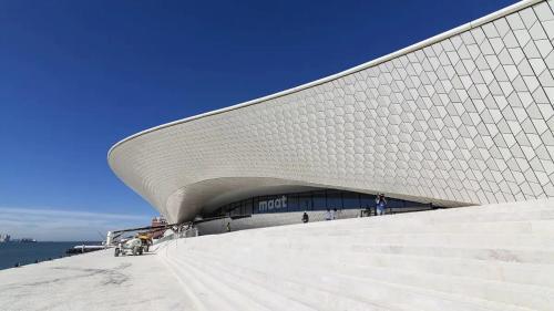 a large building with stairs in front of it at Timeless Charming - Belém in Lisbon
