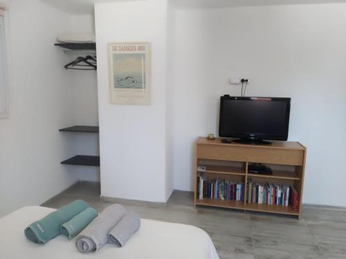 TV a/nebo společenská místnost v ubytování Aires de la costa Renovado