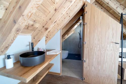 a bathroom with a large black tub on a wooden counter at WOW views next to the ski lift! in Baqueira-Beret