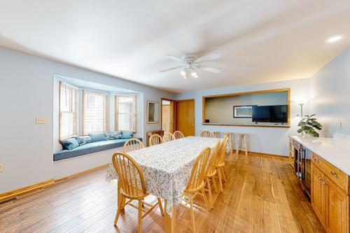 a dining room with a table and chairs and a couch at Gull's Nest --- 39638 S Gulls Way Ct in Bethany Beach