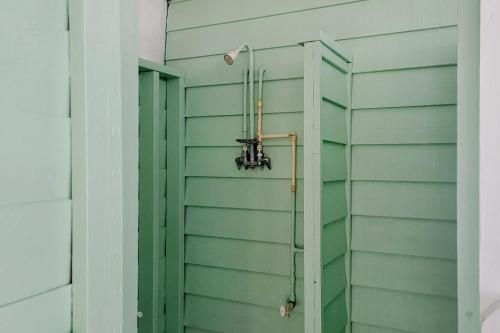 a green wall with a shower in a house at Gull's Nest --- 39638 S Gulls Way Ct in Bethany Beach
