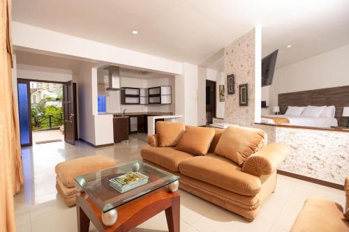 a living room with a couch and a table at Hotel Campestre La Posada Del Rancho in Popayan