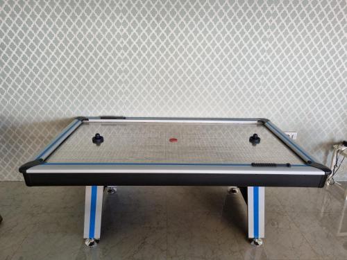 a ping pong table in front of a wall at Aljood Resort in Ras al Khaimah