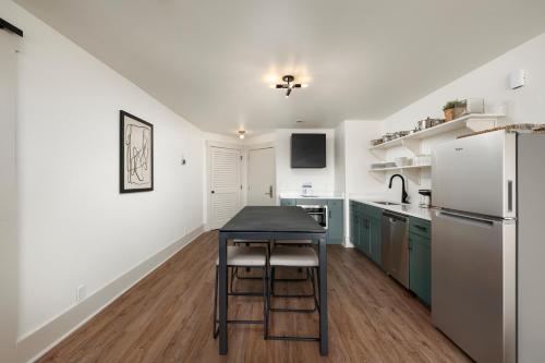a kitchen with a table and a refrigerator at Sea Palms Resort St Simons Island in Saint Simons Island