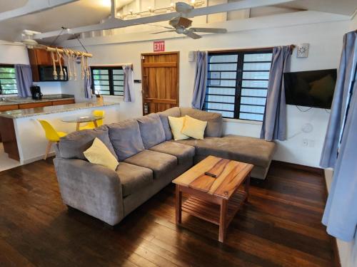 a living room with a couch and a table at Maya Beach Hotel in Maya Beach