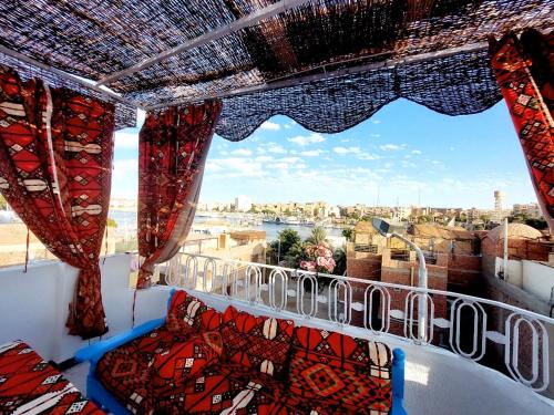 a balcony with a view of the city at Gamal Robob Nubian Guest House in Aswan