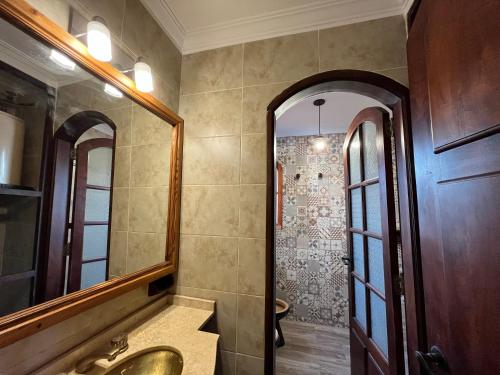 a bathroom with a sink and a mirror at Arrea Mutillak in Goya