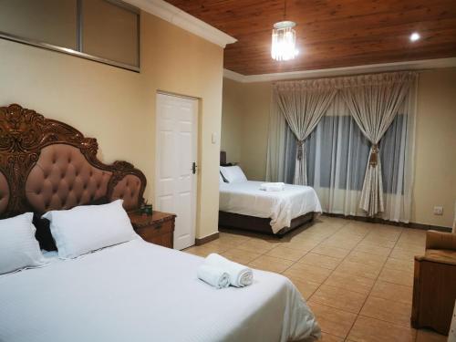 Krevet ili kreveti u jedinici u okviru objekta KwaNomzi Botique Lodge