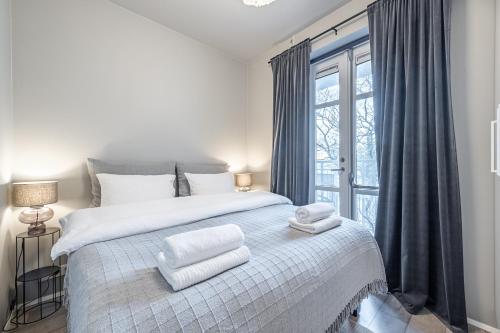 Postel nebo postele na pokoji v ubytování Downtown Reykjavik Luxury Apartments