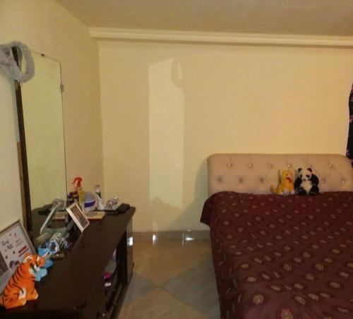 a bedroom with a bed with stuffed animals on it at Paraqar in Pʼarakʼar