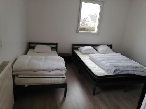 Postel nebo postele na pokoji v ubytování L'appart des Sotrés