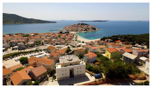 an aerial view of a town with a beach at Royal Primošten in Primošten
