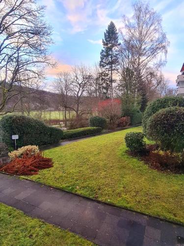 a garden with a walkway in a park at Apartment Salinenpromenade Bad Kissingen in Bad Kissingen