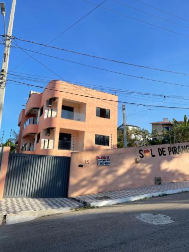 a building with graffiti on the side of a wall at Sol de Pirangi in Parnamirim