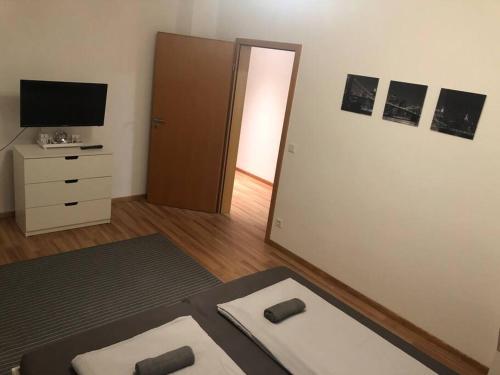 TV a/nebo společenská místnost v ubytování Ferienwohnung Tillmanns