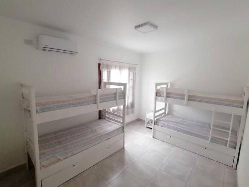 Ένα ή περισσότερα κρεβάτια σε δωμάτιο στο Casa hasta 10 personas.