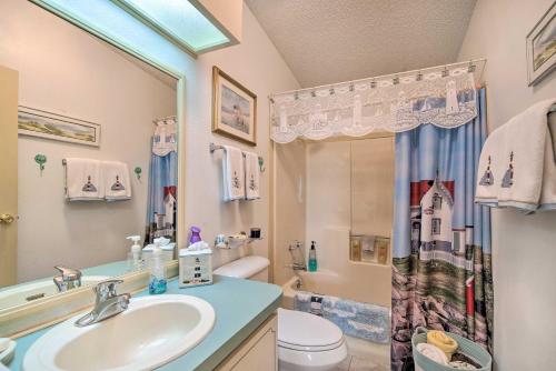 a bathroom with a sink and a toilet and a shower at Lady Lake House with Lanai and Community Pool! in Lady Lake